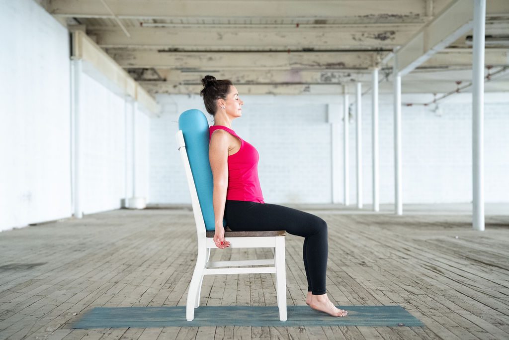 Gentle seated pose for spine relief with props with Jane Hart in Greenville SC