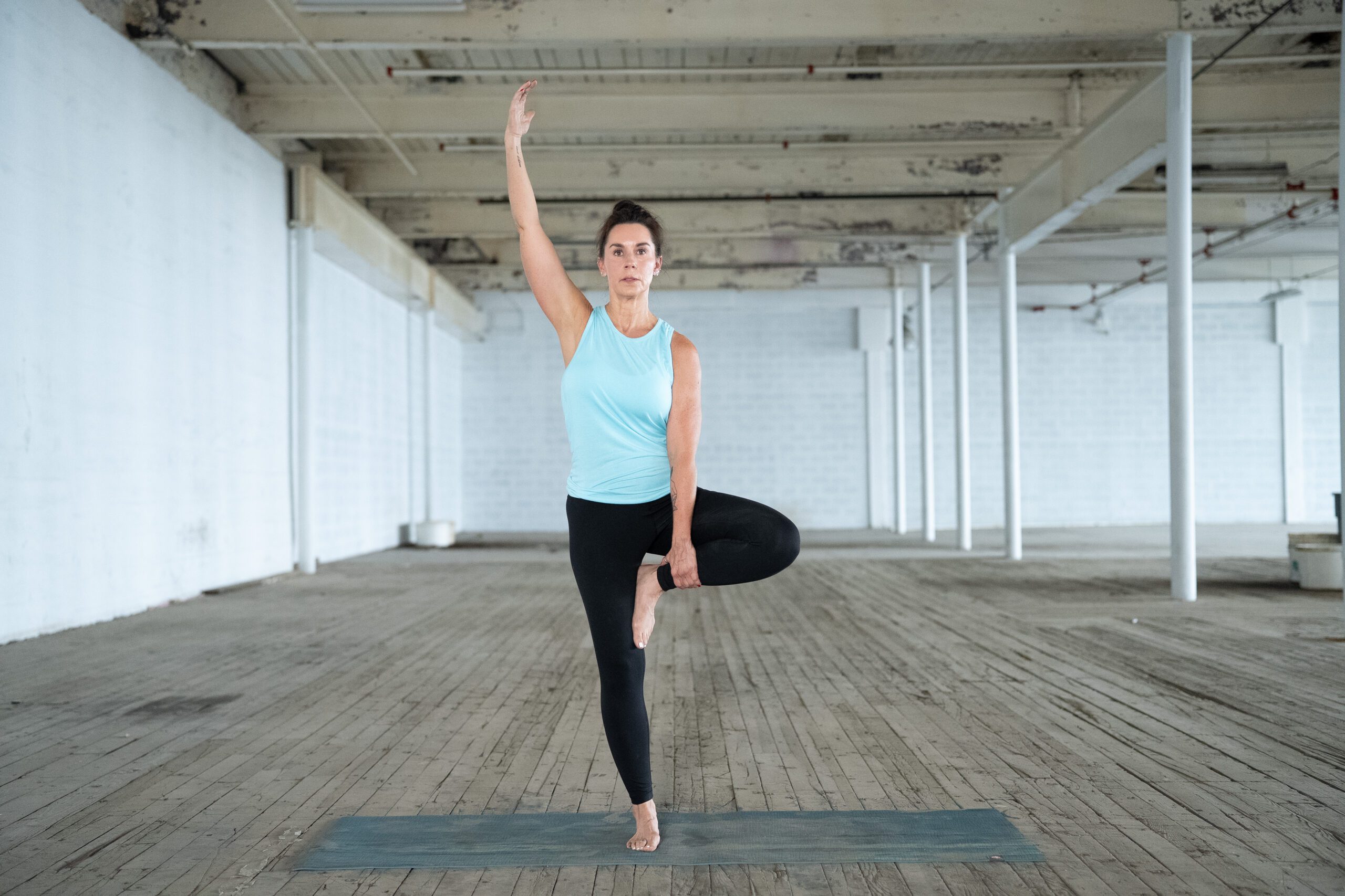 yoga for disabilities instructor jane hart demonstrates a tree pose in greenville, sc