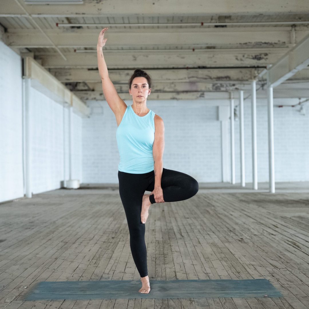 yoga for disabilities instructor jane hart demonstrates a tree pose in greenville, sc